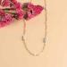 Collier Lueur rose posee web